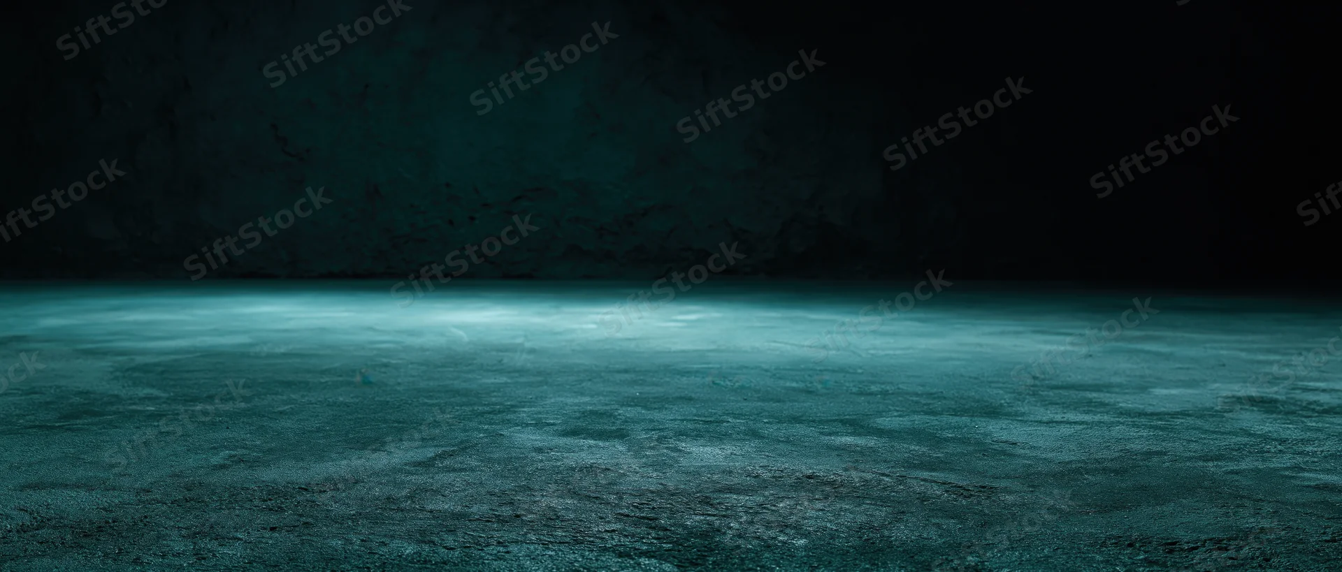 Dark teal textured floor in a cave-like underground space with dim ambient lighting and copyspace