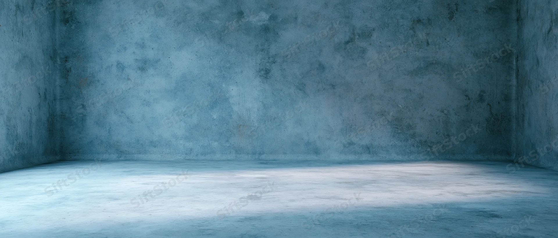 Empty concrete room with blue-toned walls and floor, interior space showing corner and texture
