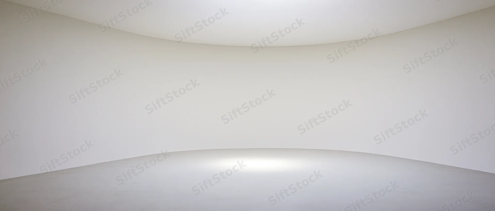 Curved white walls and ceiling forming a seamless empty interior space