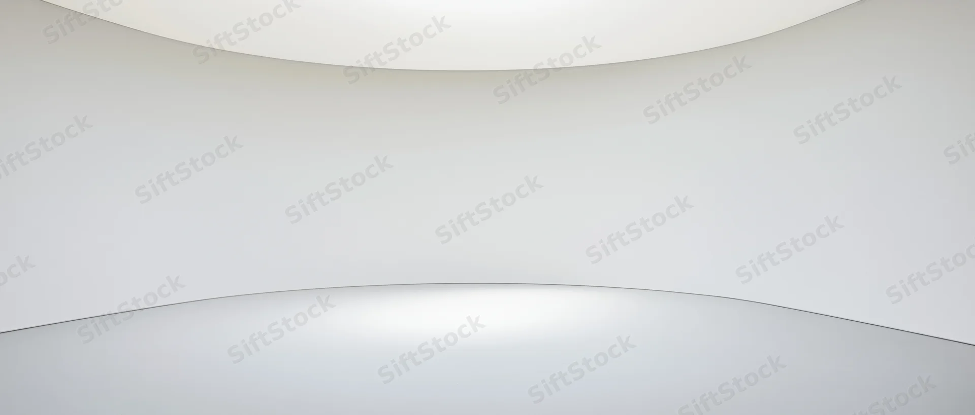 Curved white walls and ceiling forming an empty minimalist interior space with smooth floor and soft ambient lighting