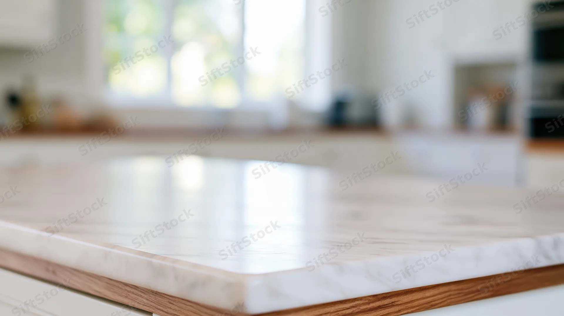 Marble countertop with wood edge in a bright modern kitchen interior