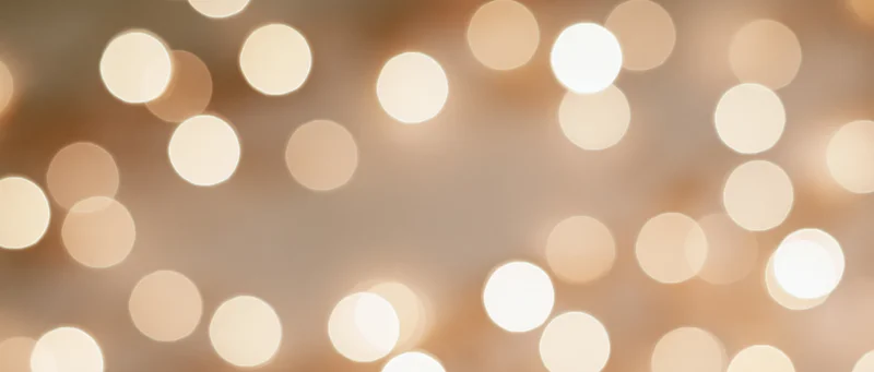 Warm bokeh lights arranged in a soft glowing pattern across the frame
