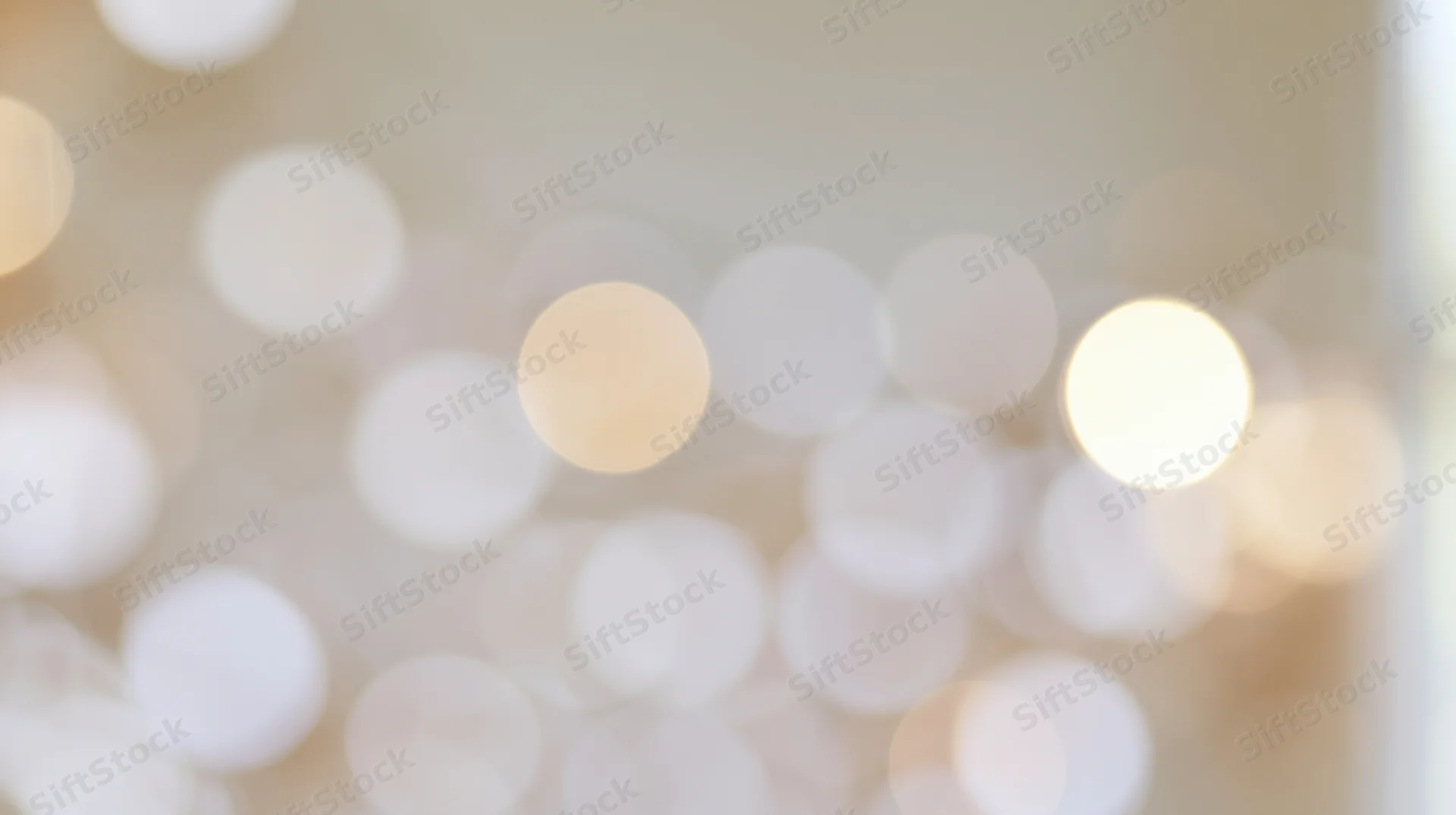 Blurred circular lights creating a warm glowing background with soft bokeh effect