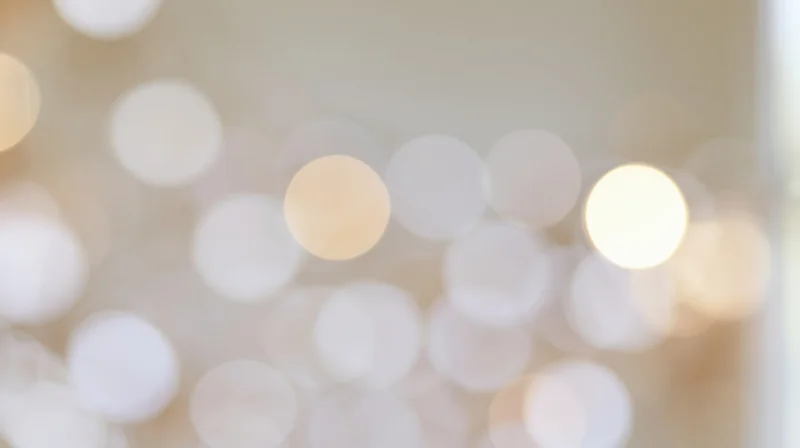 Blurred circular lights creating a warm glowing background with soft bokeh effect