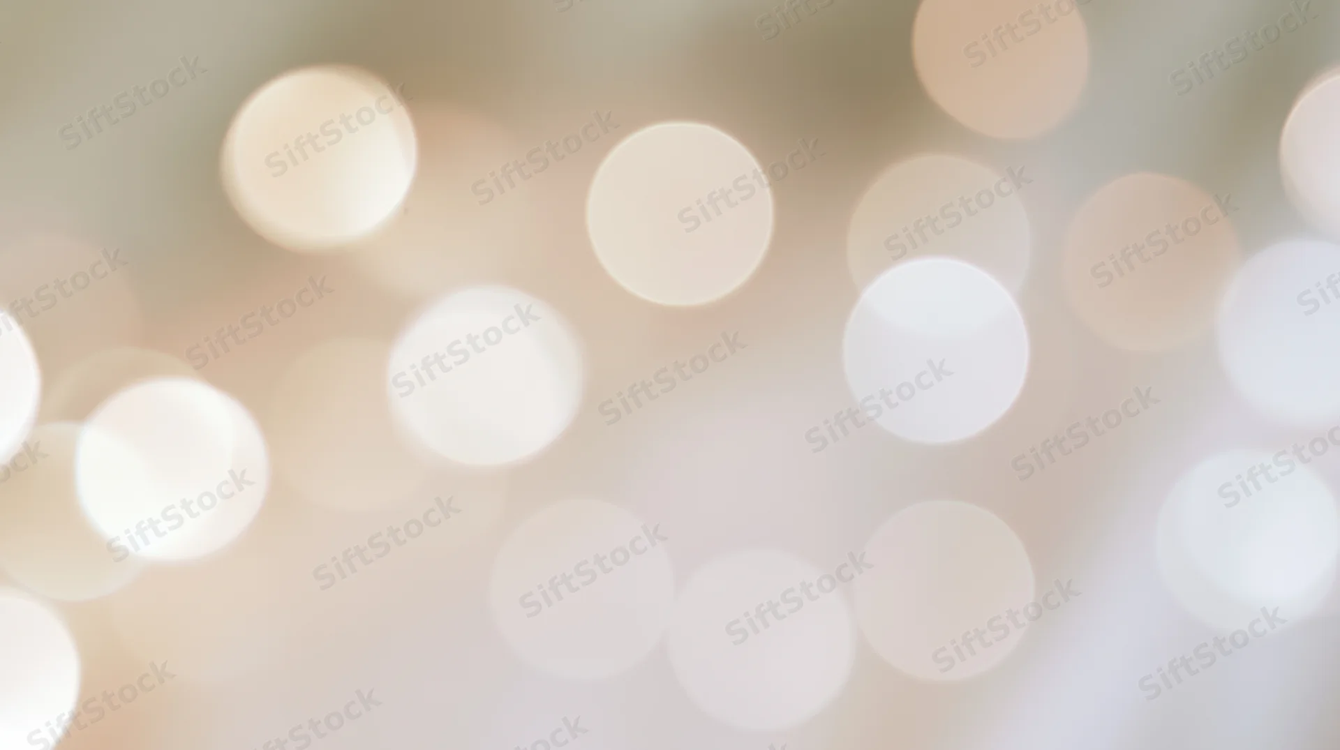 Blurred circular lights creating a soft glowing background with warm tones and festive ambiance