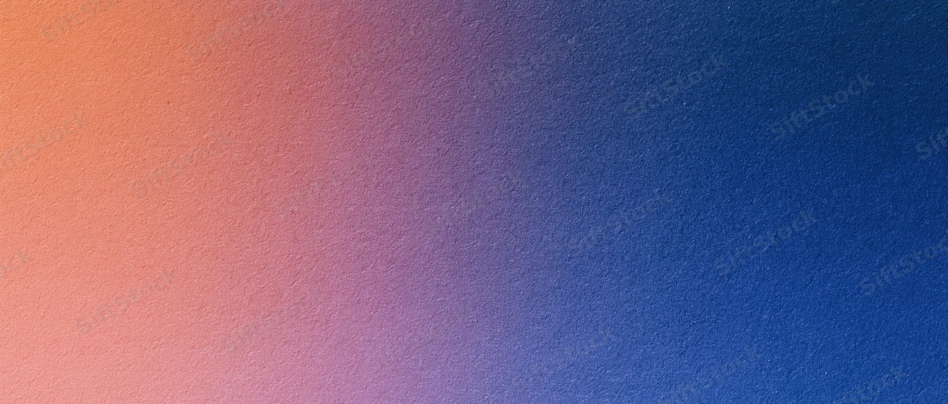 Smooth color gradient transitioning from orange to blue across a textured surface