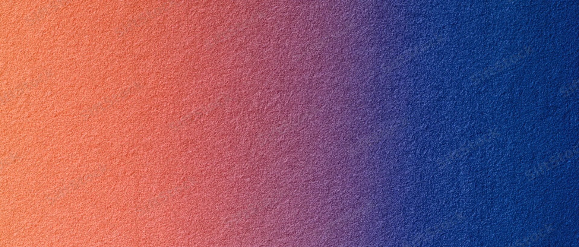 Smooth color gradient transitioning from orange to blue across a textured surface