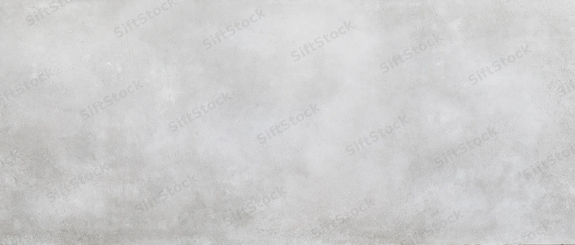 Gray textured concrete surface filling the frame as a seamless background