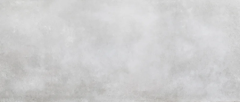 Gray textured concrete surface filling the frame as a seamless background