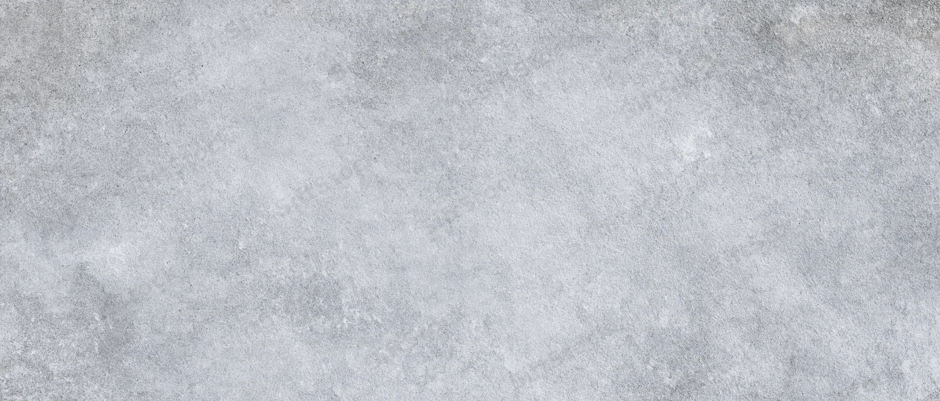 Gray concrete surface with rough texture and subtle variations in tone