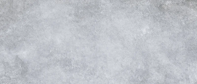 Gray concrete surface with rough texture and subtle variations in tone