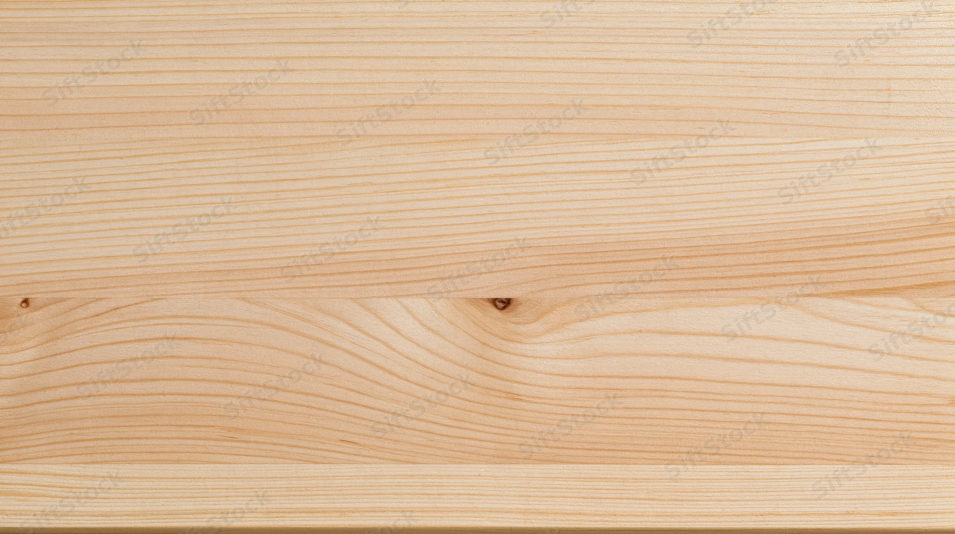 Light pine wood surface with horizontal grain pattern and natural knots, showing smooth texture and warm tone