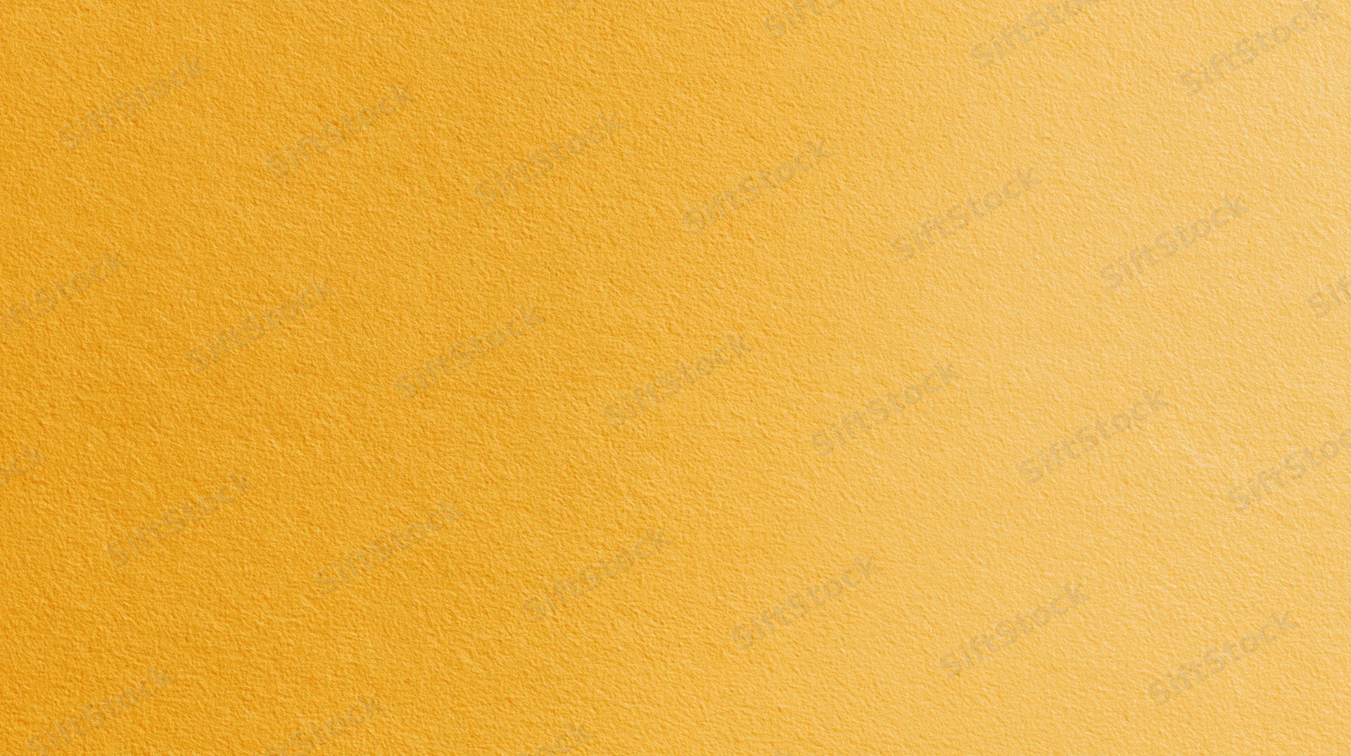 A solid yellow textured surface filling the frame as a uniform background