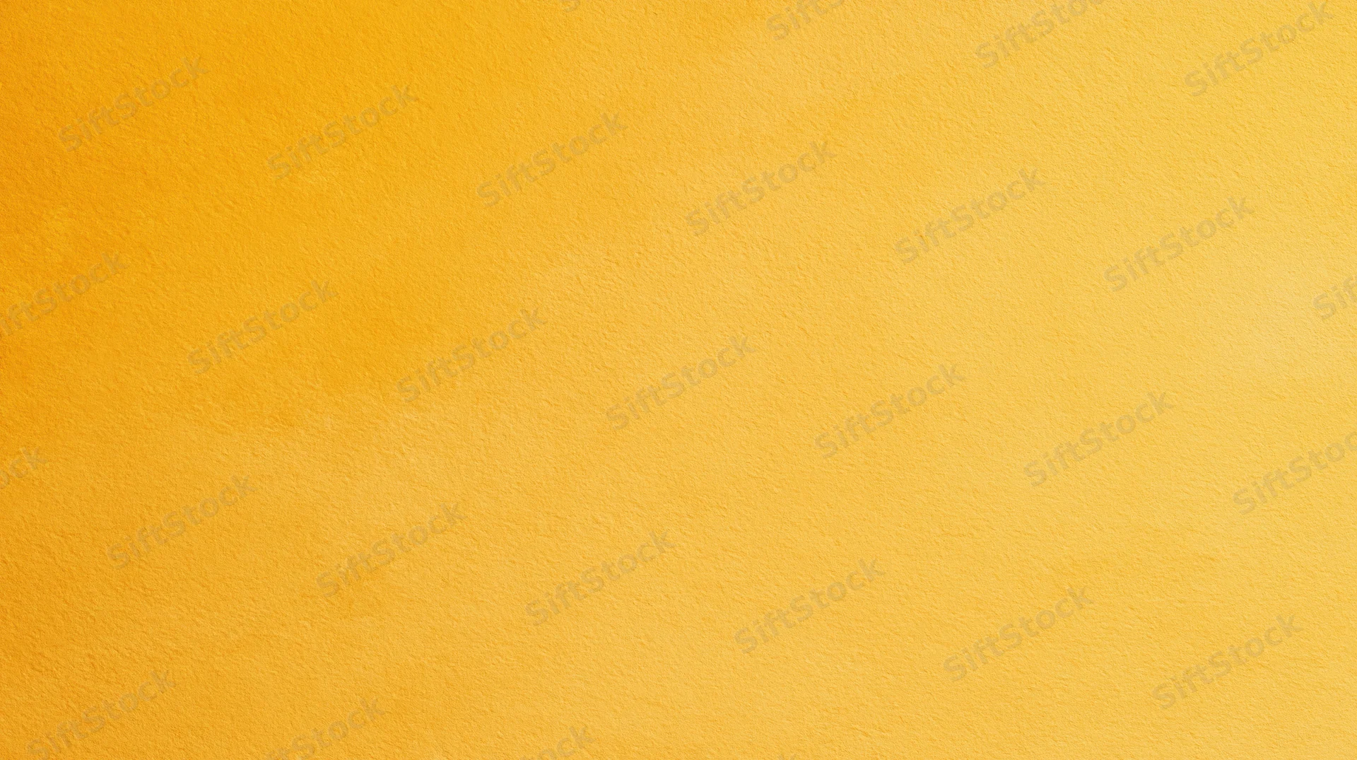 A solid yellow textured surface filling the frame as a background