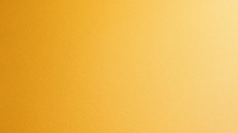A smooth yellow gradient background with subtle texture and even lighting