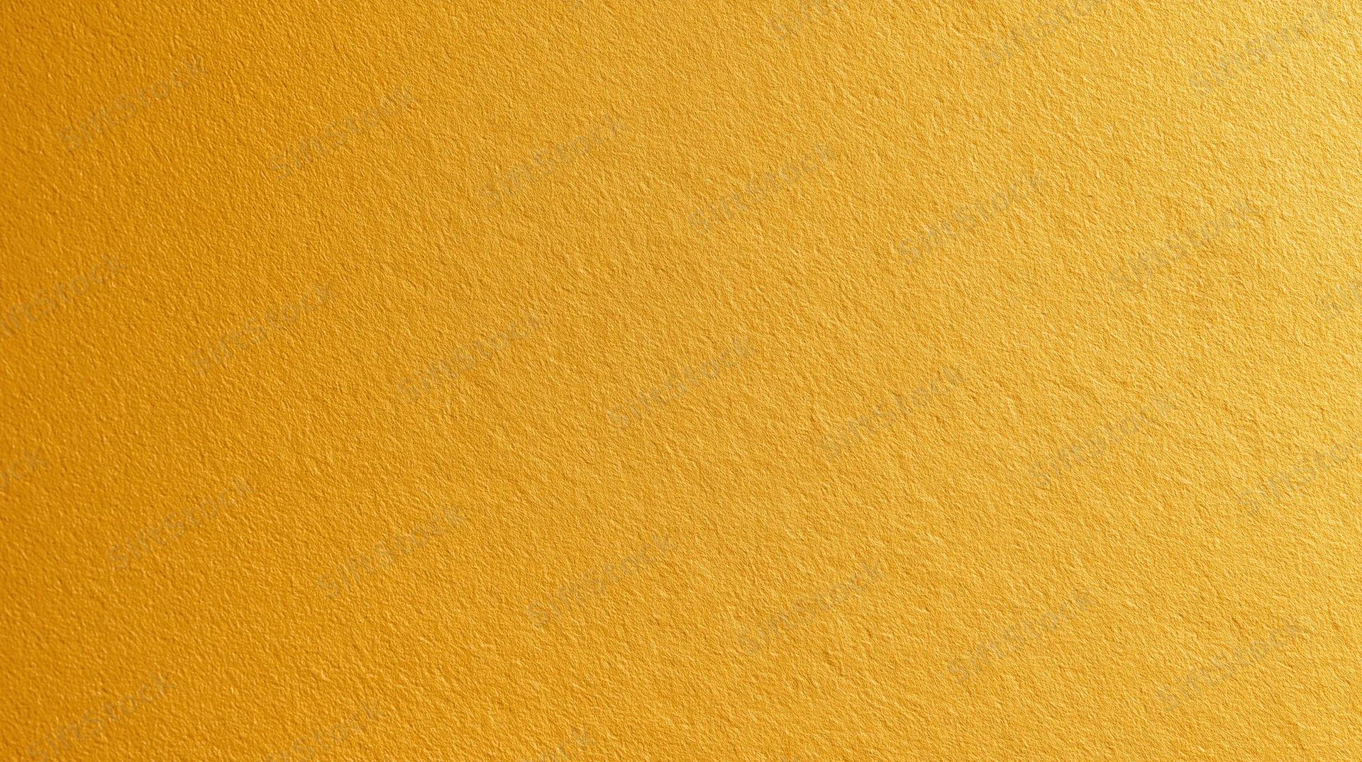 A smooth yellow textured surface filling the frame as a uniform background