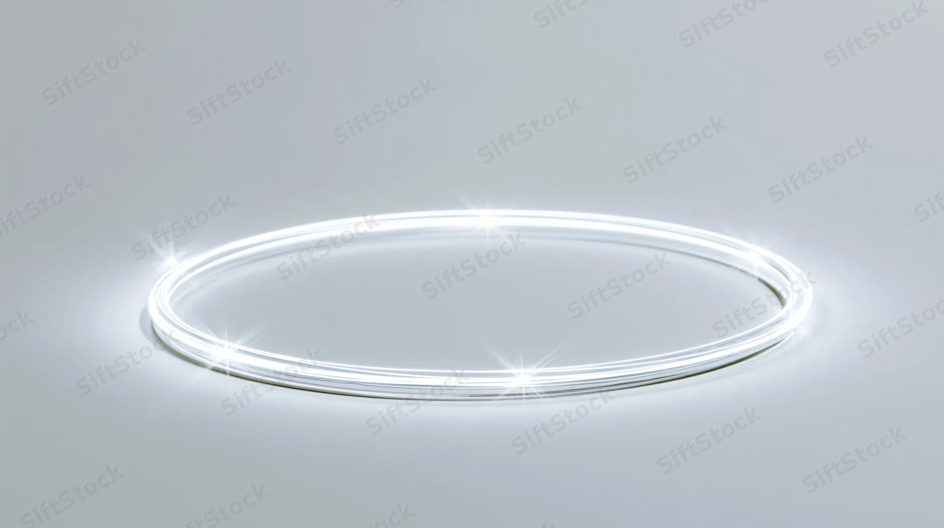 Glowing white circular ring on a smooth gradient surface with copyspace