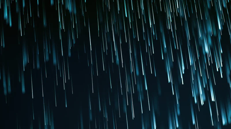 Blue streaks of falling rain against a dark night sky