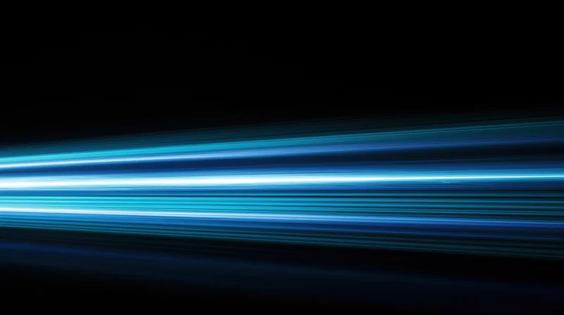 Horizontal blue light streaks moving across a dark background