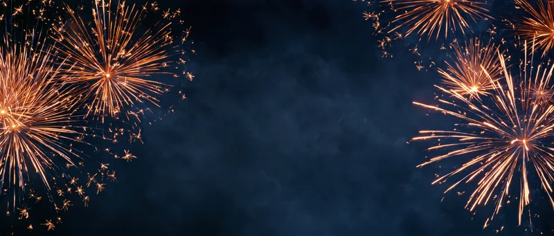 Golden fireworks bursting in the night sky with smoky trails and copyspace in the center