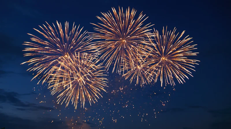 Golden fireworks bursting in the night sky during a celebration