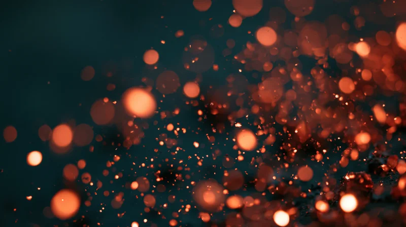 Glowing orange bokeh lights floating in dark space with soft blur and warm glow
