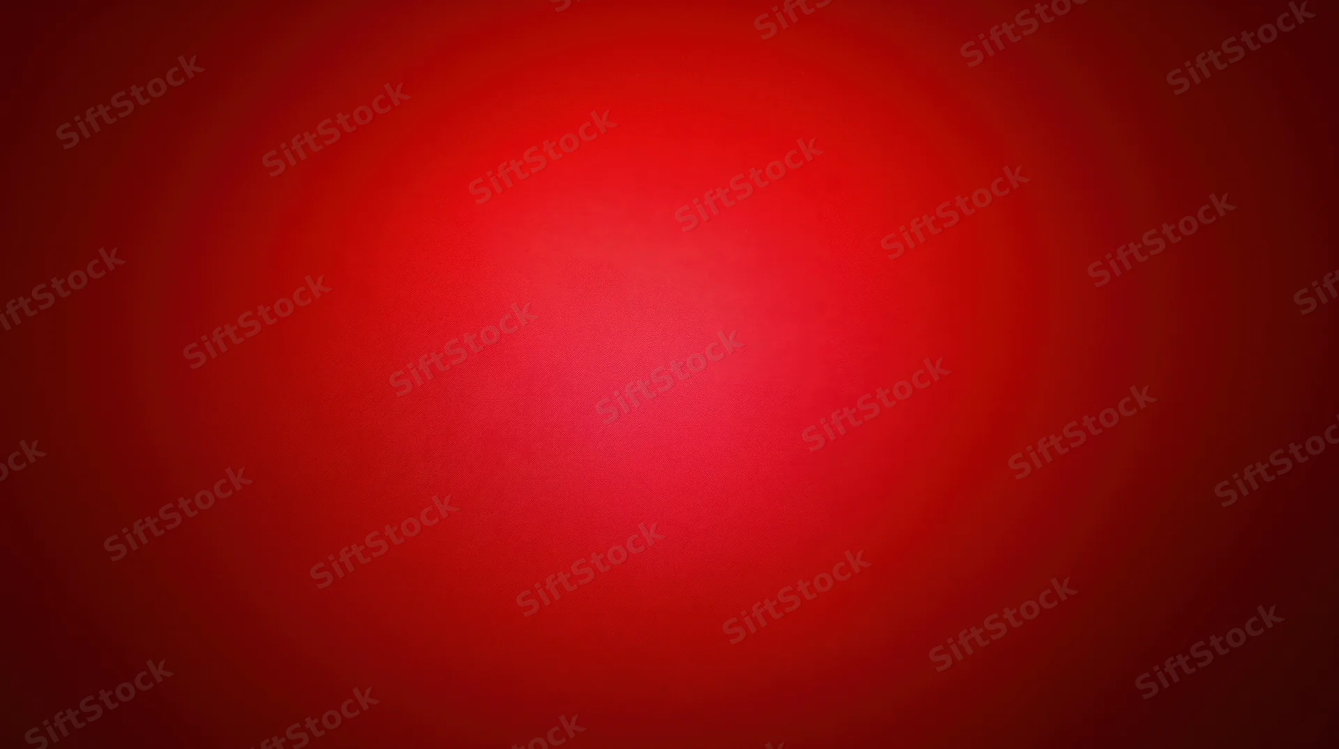 A red gradient background with soft radial light centered in the frame