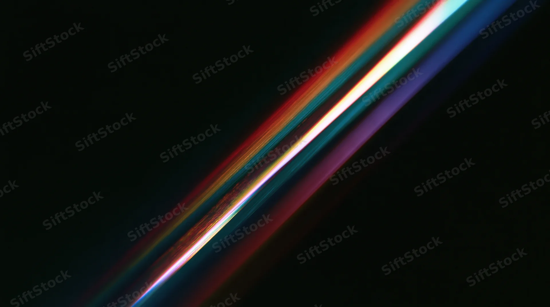 Diagonal streaks of rainbow-colored light moving across a dark background
