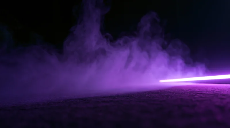 Purple neon light glowing through smoke on a dark textured floor