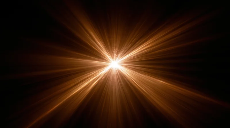 Radiant golden light burst emanating from center against dark background