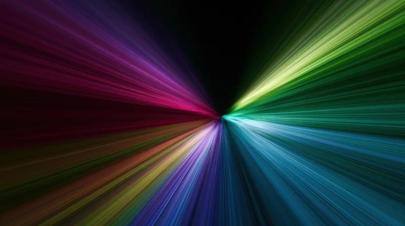Radiant multicolored light beams bursting from a central point in a dark space