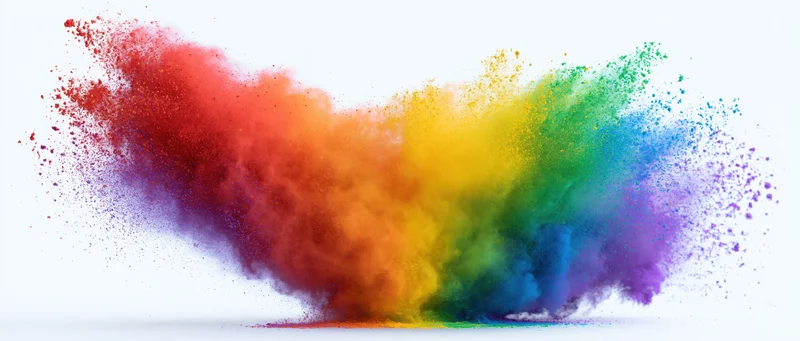 Colorful powder explosion in mid-air against white background