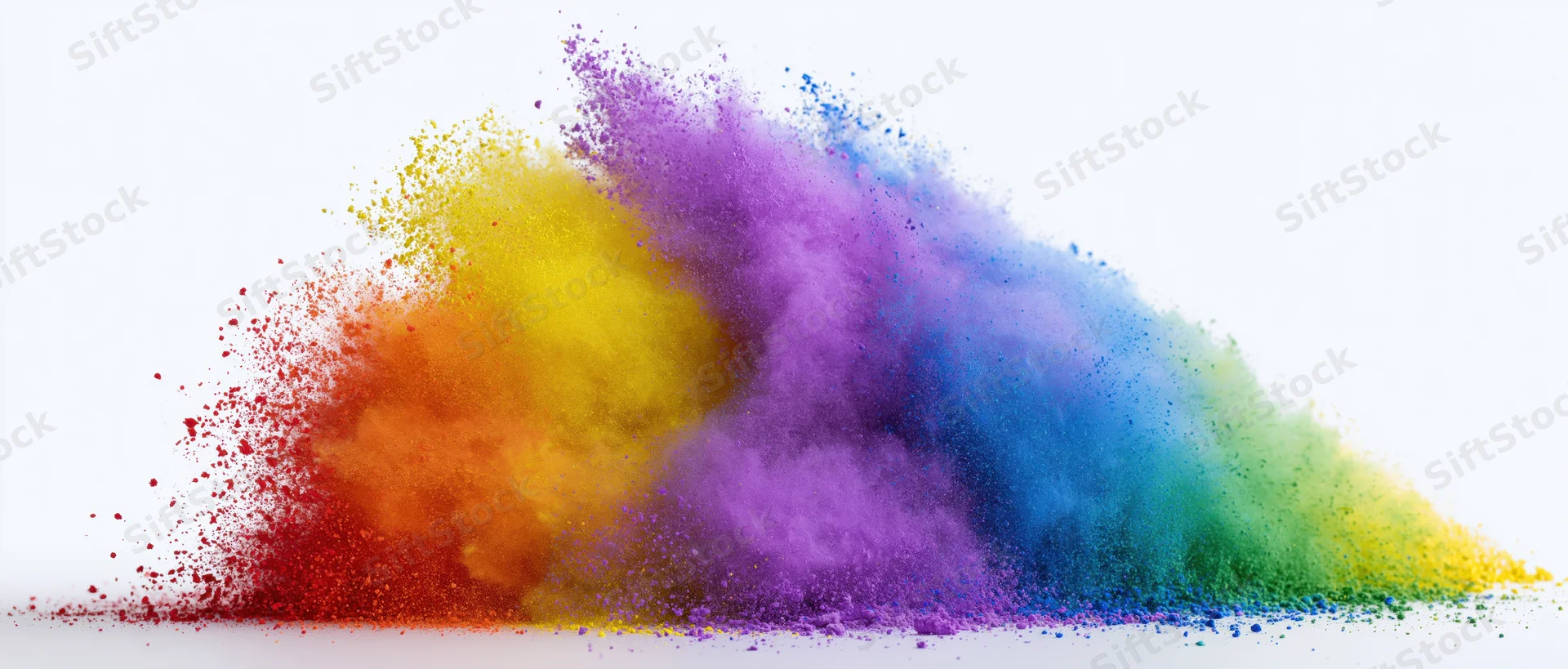 Colorful powder exploding in a rainbow burst against a white background