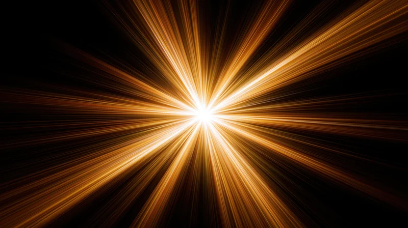 Radiant golden light burst expanding from center against black background