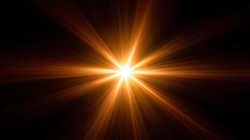 Bright light burst radiating from center against dark background with golden rays and copyspace