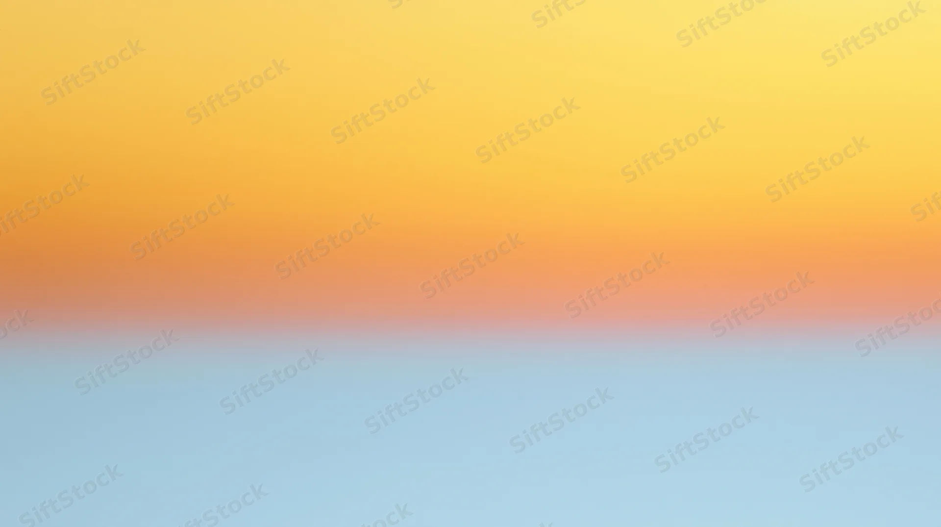 A smooth color gradient transitioning from yellow to blue with a soft orange band in the middle