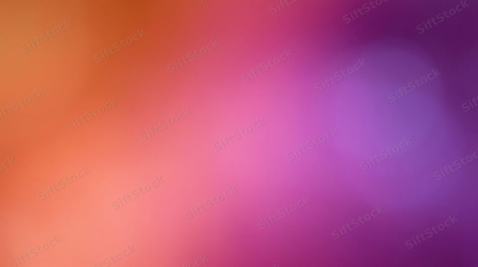 Soft gradient of pink, purple, and orange hues blending smoothly across the frame