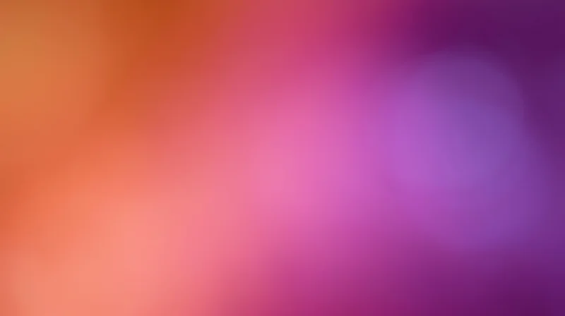 Soft gradient of pink, purple, and orange hues blending smoothly across the frame