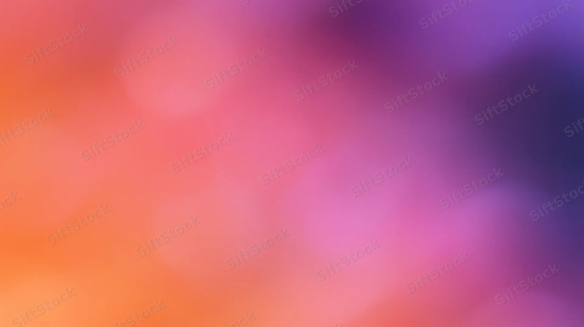 Abstract bokeh background with soft pink, purple, and orange gradient blend