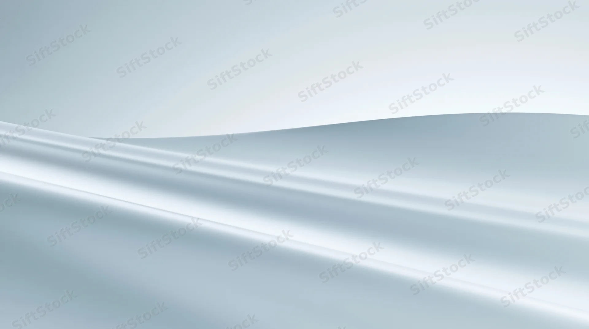 Smooth flowing white and silver gradient surface with soft light waves