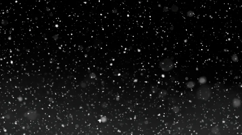 Falling snow particles against a dark night sky with bokeh effect
