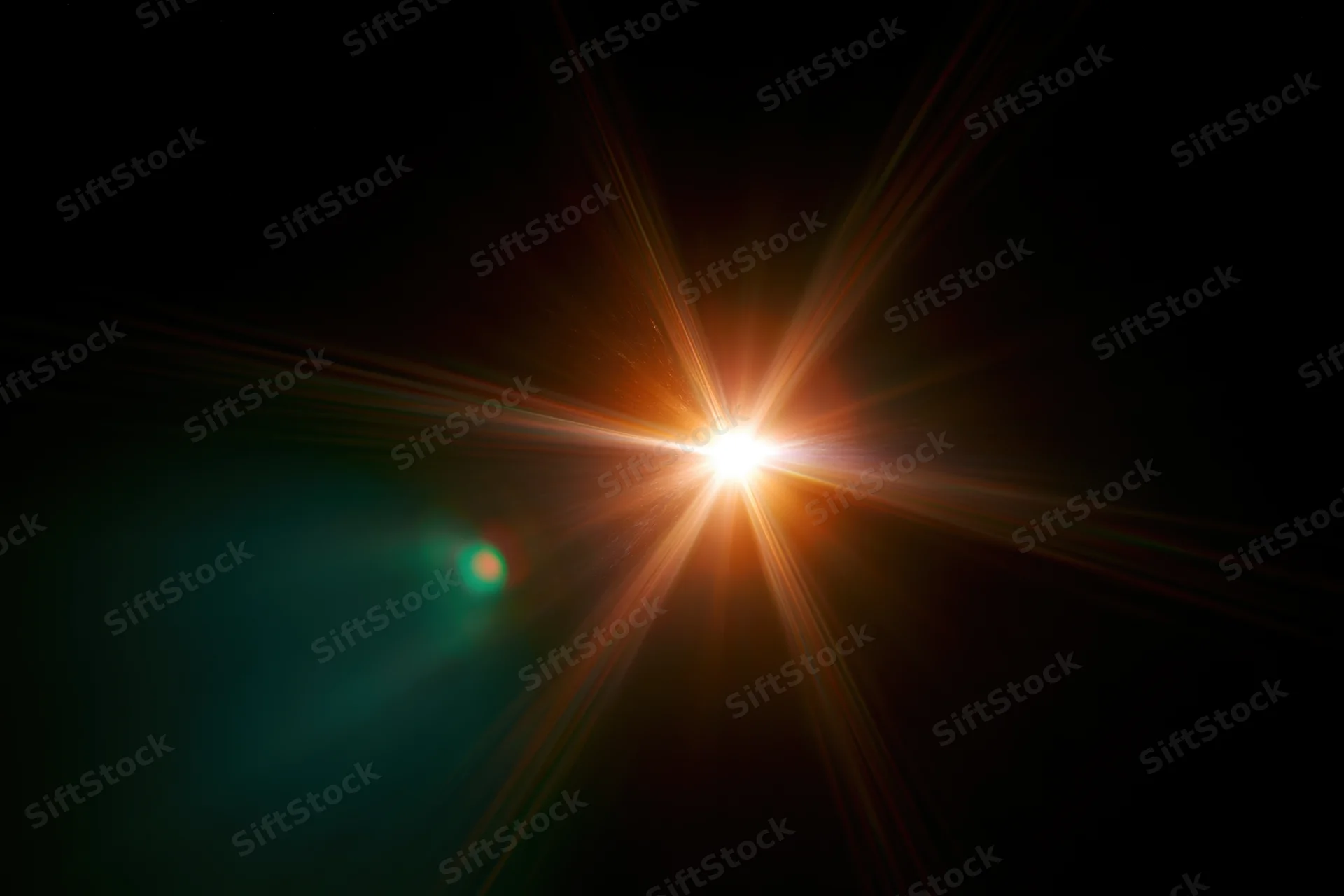 Bright point light source glowing with starburst flare against dark background