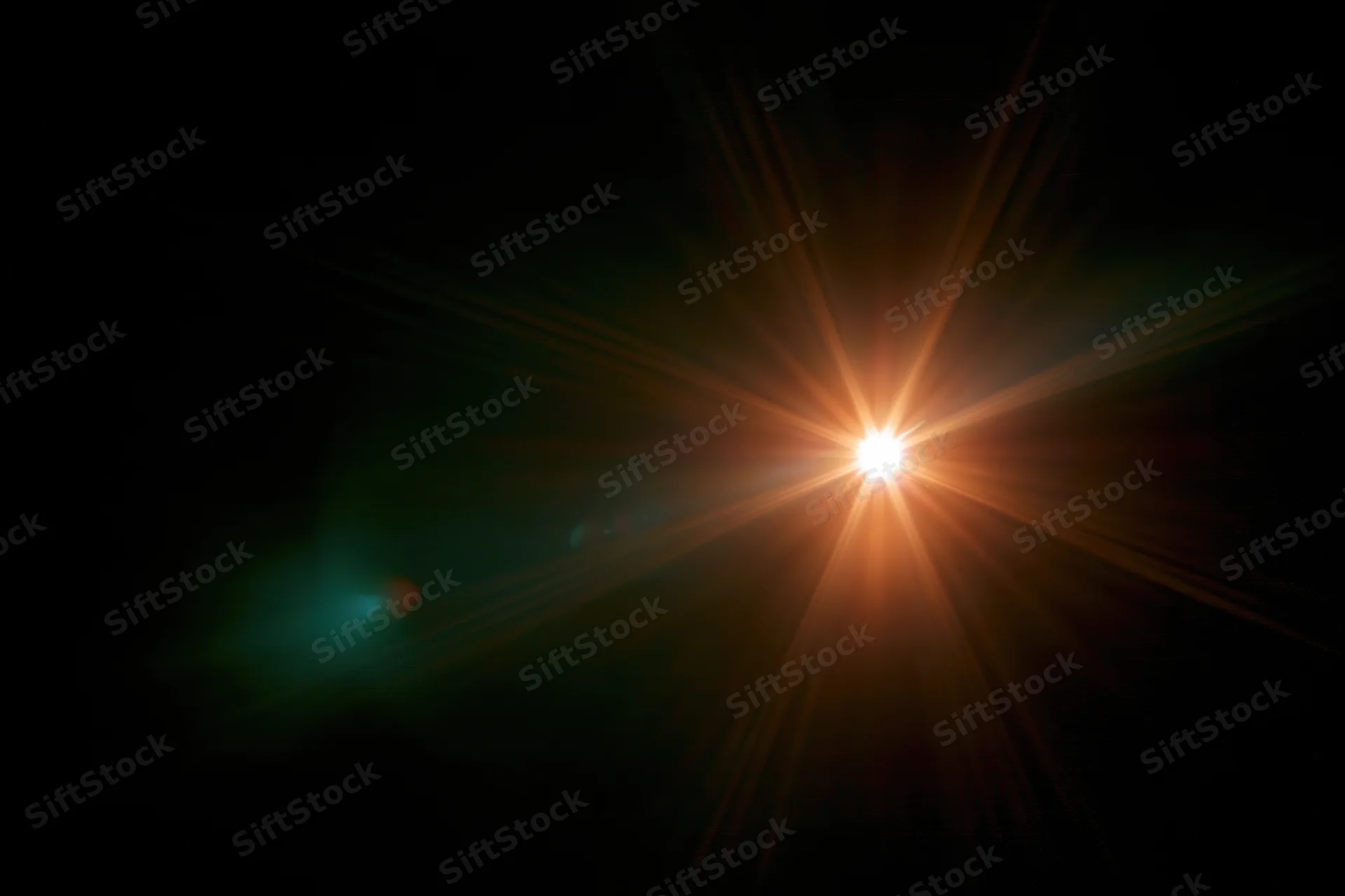 Bright point light source glowing with starburst flare against dark background