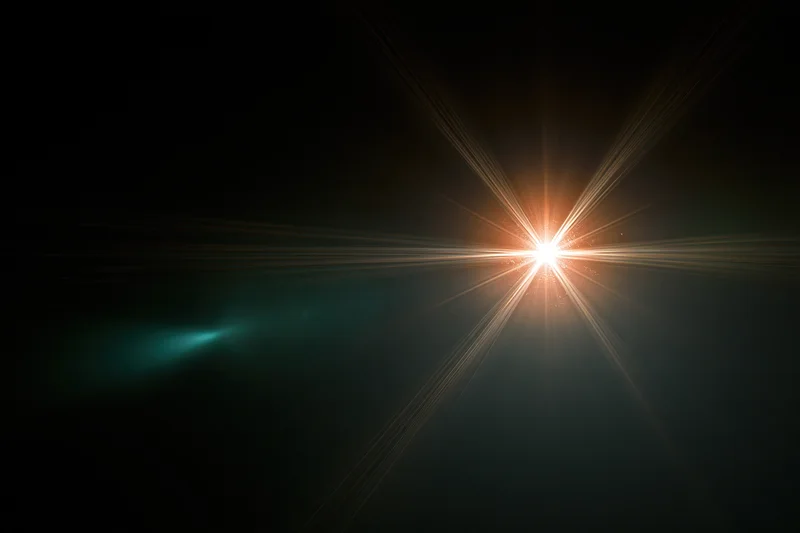 Bright point light source glowing with starburst rays against dark background