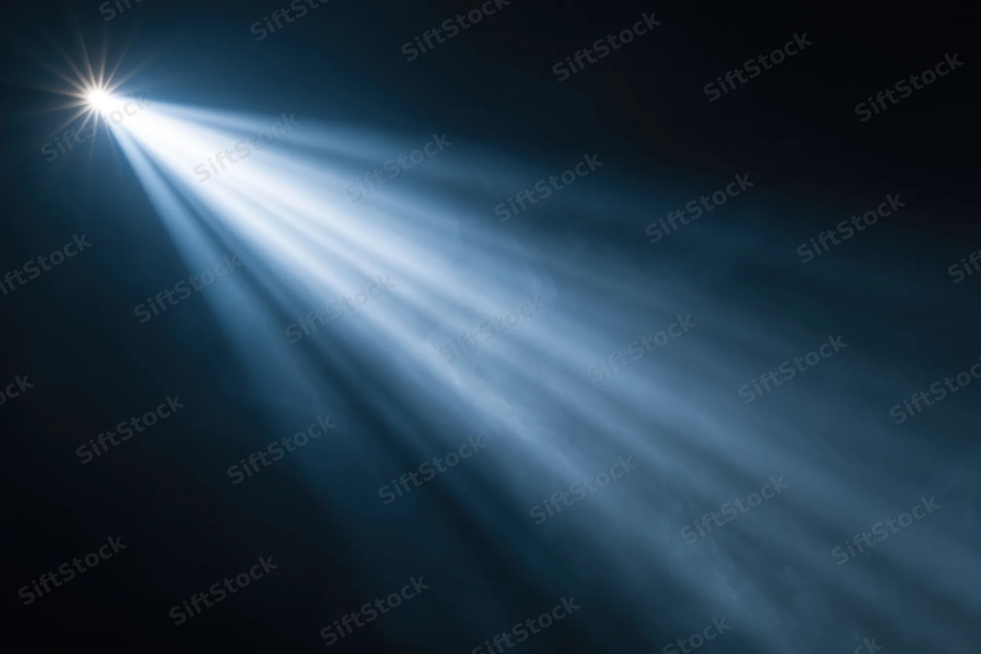 Bright spotlight beam cutting through haze and smoke in dark space