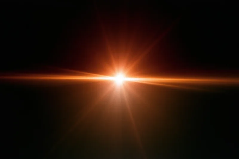Intense orange-gold lens flare streak cutting horizontally across dark background with starburst effect