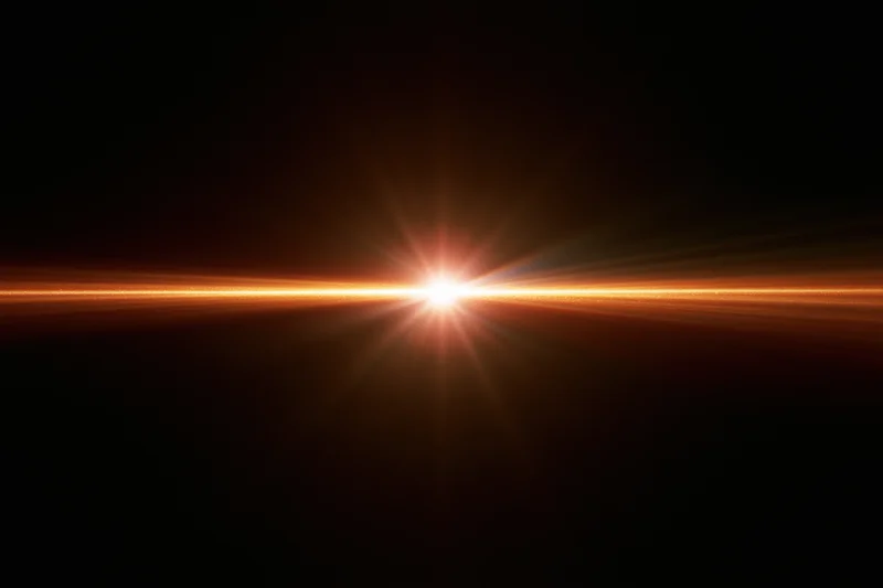 Horizontal orange-gold lens flare streak glowing intensely against black background