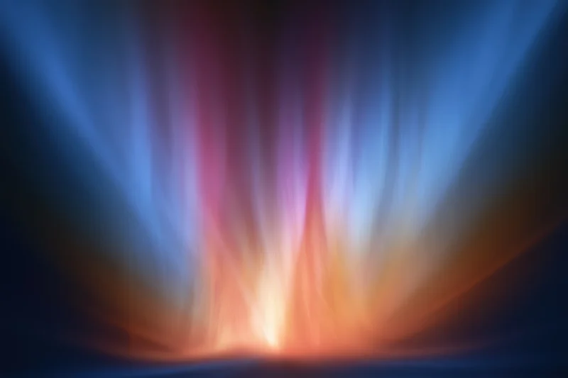 Abstract light streams rising from a bright center in a dark space