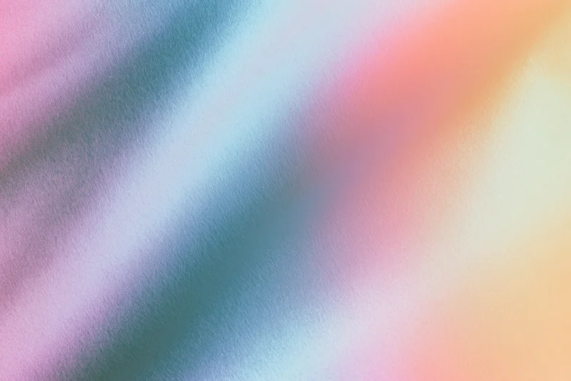 Smooth gradient color blend across abstract textured background