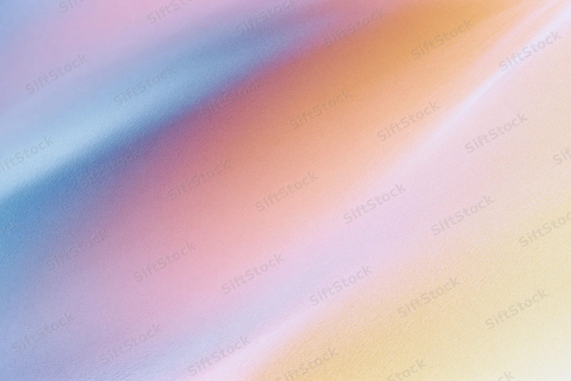 Smooth diagonal gradient of pastel colors blending across the frame as a textured background